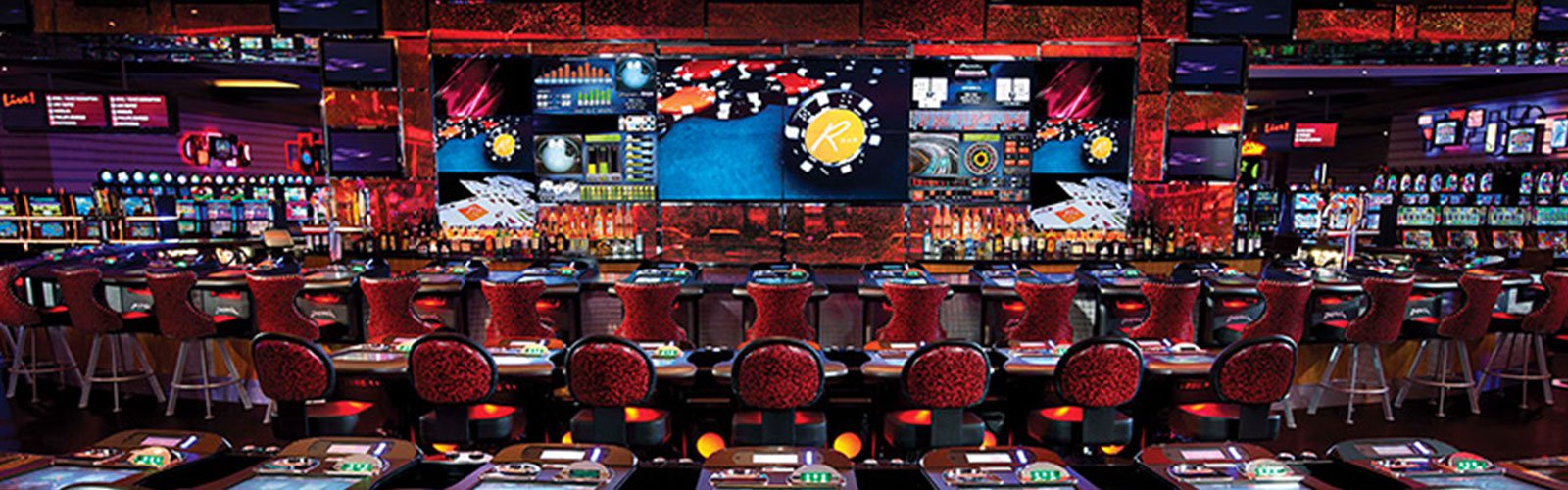 Casino with bar and video displays everywhere (background)